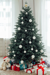Christmas tree with gift decoration decor balls garlands new year interior