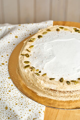 Carrot cake. Board with delicious tasty homemade cake on table. Wooden background.