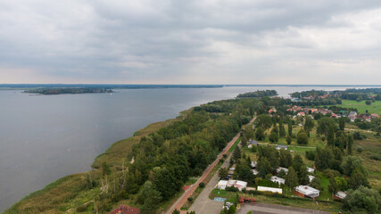 Fototapeta na wymiar Trzebiez, Poland. Aerial view on coast of Zalew Szczecinski and forest. Drone photo 