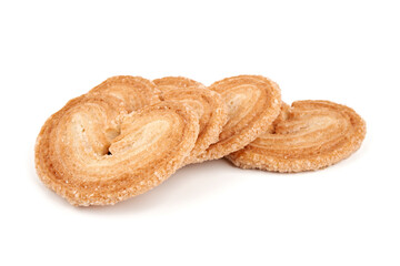 Puff pastry cookies. Fresh puff pastry cookies in the shape of a heart. Classic French pastries. Pig ear, elephant ear cookies, French hearts. Heart shaped puff pastry isolated on white background