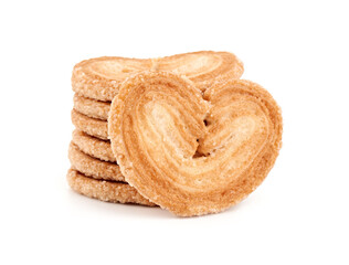 Puff pastry cookies. Fresh puff pastry cookies in the shape of a heart. Classic French pastries. Pig ear, elephant ear cookies, French hearts. Heart shaped puff pastry isolated on white background