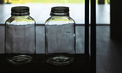 Two empty glass jars
