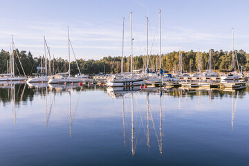Fototapeta na wymiar Sail Boats on a beautiful cloudless morning in a Swedisch harbour