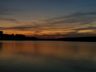 Naklejka premium sunset over the river