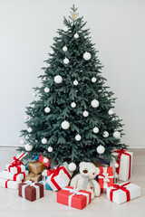 Christmas tree with gift decoration decor balls garlands new year interior