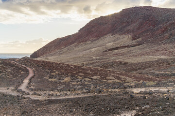Montaña Roja is one of the eyecatchers of the canary island Tenerife. With volcanic ground and nice tracks you can almost walk around it and you can walk to the top.