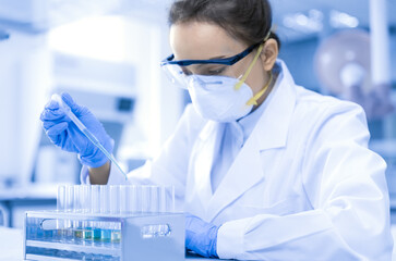 Young female scientist working in laboratory	