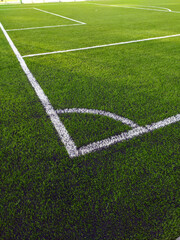 Artificial grass soccer field. Corner kick line of ball and a soccer field , football field , background texture © Smole