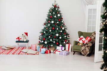 Christmas tree with gift decoration balls garlands new year interior