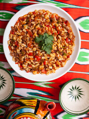 Pilaf, a national oriental dish made from rice, beef, carrots and onions. Eastern cuisine