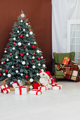 New Year's Christmas tree with gift decoration balls garlands interior