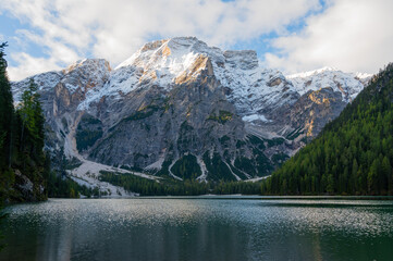 View of Mount Seekofel mirroring in the clear calm water of iconic mountain lake Pragser Wildsee (Lago di Braies) in Italy, Dolomites, Unesco World Heritage, South Tyrol