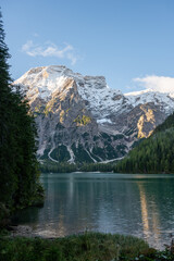 View of Mount Seekofel mirroring in the clear calm water of iconic mountain lake Pragser Wildsee (Lago di Braies) in Italy, Dolomites, Unesco World Heritage, South Tyrol
