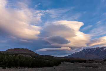 Lenticular clouds formation over the mountains during sunset in Esquel, Patagonia, Argentina