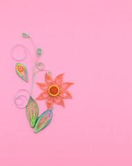 Quilling paper flower on pink background