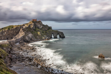 photography of a landscape with long exposure with silk effect. A church on top of the stone...