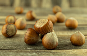 Hazelnut on a wood background with space for text