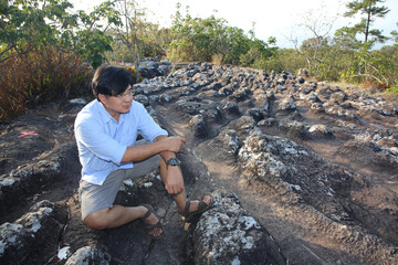 man sitting on stone