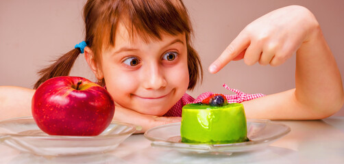 Close up young girl eating cake. Horizontal image.