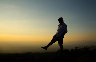 Fototapeta na wymiar a man on a mountain top. Person on the rock. Sport and active life concept. Beauty world.