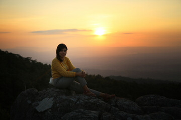 a woman on a mountain top. Person on the rock. Sport and active life concept. Beauty world.