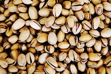 Lots of pistachio nuts. View from above. Flat lay