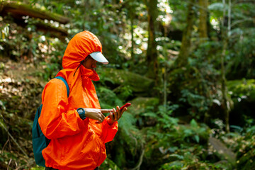 Traveler woman trekking with backpack.
