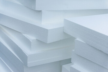 Expanded polystyrene plates. A stack of building materials for house insulation. Close-up - obrazy, fototapety, plakaty