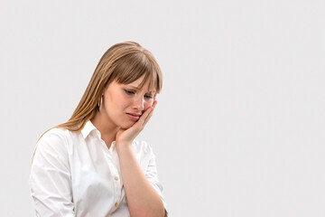 Fototapeta premium Young girl has a toothache or is upset about something