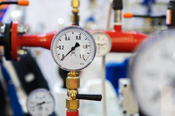 Barometer in an industrial boiler room. Sensor with an arrow at zero. Turning off heating during...