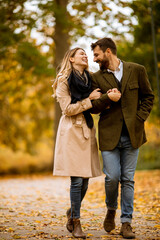 Fototapeta premium Young couple walking in the autumn park
