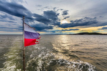 Beautiful seascape with russian flag, Barents sea.