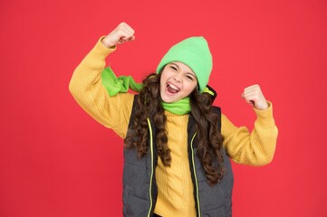 happy teen girl wear knitted clothes. xmas winter shopping. cold season fashion. child with warm clothing. kid ready to celebrate the holiday. merry christmas. new year sales. beauty in style