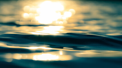 Light reflections in the rippled water surface