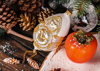 Christmas vintage Christmas decorations, coniferous branches, nuts, pine cones as a decor on wooden boards