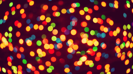Wide picture of bokeh balls of different colors of the garland light. Festive Christmas atmosphere