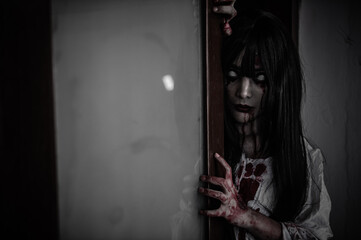 Portrait of asian woman make up ghost,Scary horror scene for background,Halloween festival...