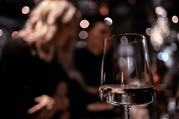 restaurant table view evening wine glass, friends at the party