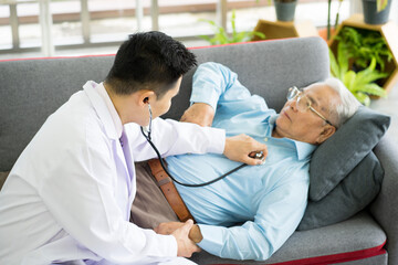 Asian medical doctor with stethoscope diagnosis the senior old patient in clinic hospital. Healthcare and medicine concept.. virus pandemic infection concept. 