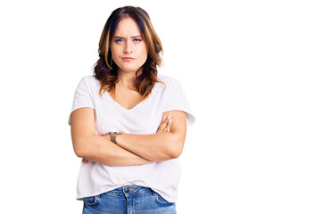 Young beautiful caucasian woman wearing casual white tshirt skeptic and nervous, disapproving expression on face with crossed arms. negative person.