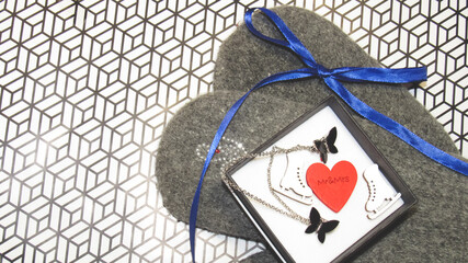 An open gift. The box contains a heart and toy skates.            