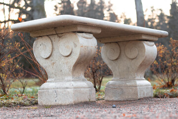 Marble garden bench in park closeup