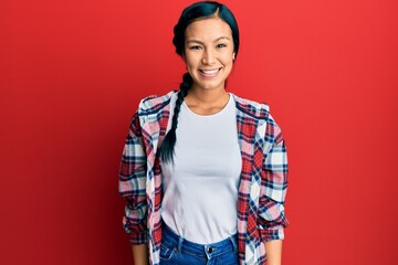 Beautiful hispanic woman wearing casual clothes with a happy and cool smile on face. lucky person.