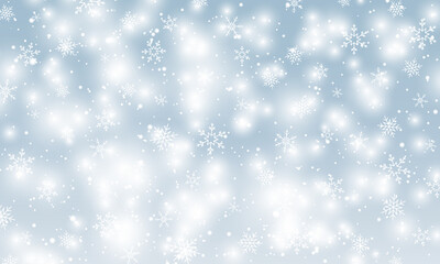 Snow background. Winter snowfall. White snowflakes on blue sky. Christmas background. Falling snow.