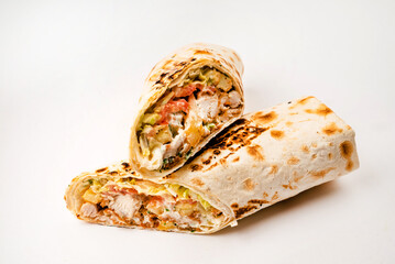 Tortilla wrap with fried chicken meat and vegetables isolated on white background