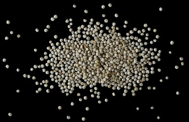 Naklejka na ściany i meble Organic quinoa seeds isolated on black background, top view