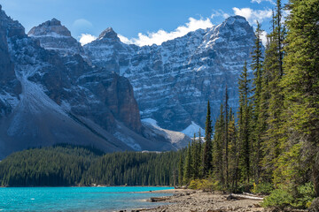 Moraine lake beautiful landscape in summer sunny day morning. Sparkle turquoise blue water, snow-covered Valley of the Ten Peaks. Banff National Park, Canadian Rockies, Alberta, Canada