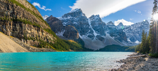 Naklejka na ściany i meble Moraine lake beautiful landscape in summer to early autumn sunny day morning. Sparkle turquoise blue water, snow-covered Valley of the Ten Peaks. Banff National Park, Canadian Rockies, Alberta, Canada