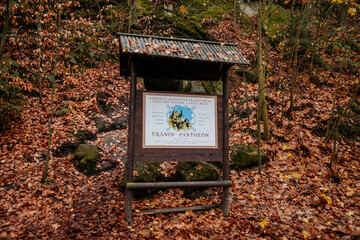 Information board on the top of sandstone rock formation, Hiking Golden Trail of Bohemian Paradise near Vranov castle Pantheon, Mala Skala, Czech Republic