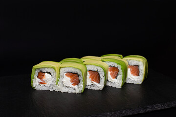 sushi hot rolls on black background dish japanese cuisine